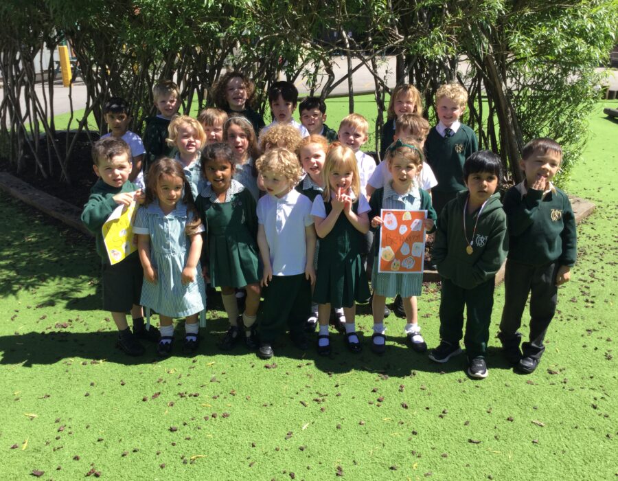 children stood outside with a picture