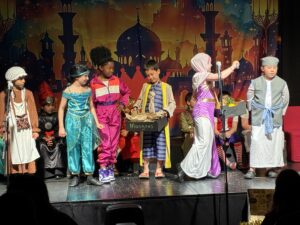 Aladdin on stage at Wilmslow Prep